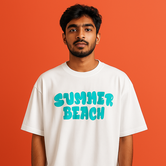 Model wearing white drop shoulder t-shirt with 'Summer Beach' graphic print on orange background.